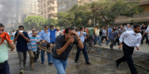 Au Caire, les forces de sécurité dispersent dans le sang les sit-in pro-Morsi